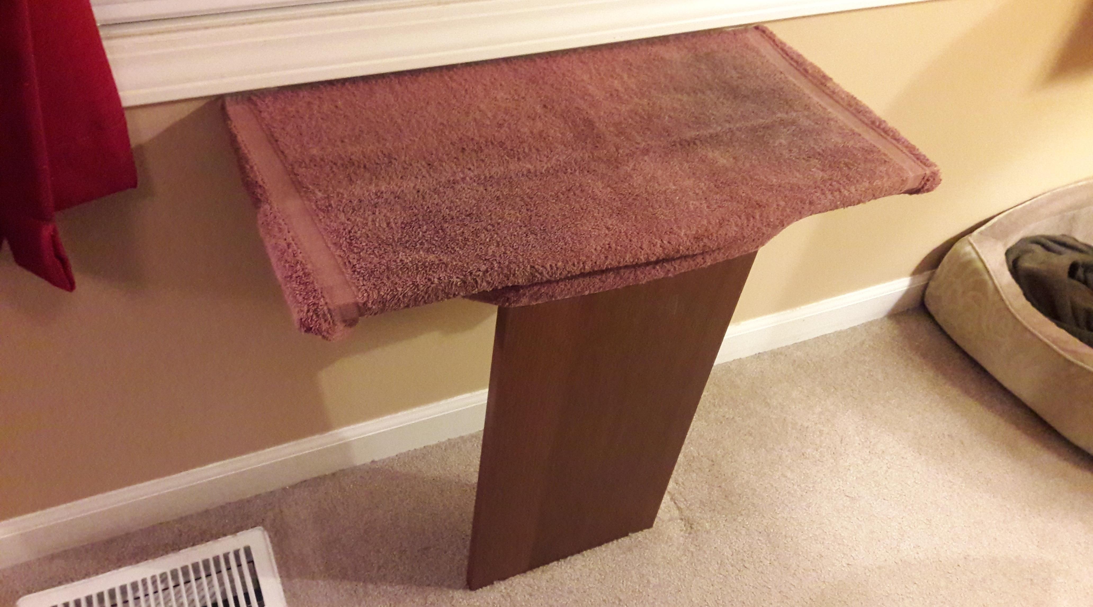 diy cat perch mounted to a wall