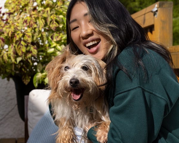 A small dog with the pet parent